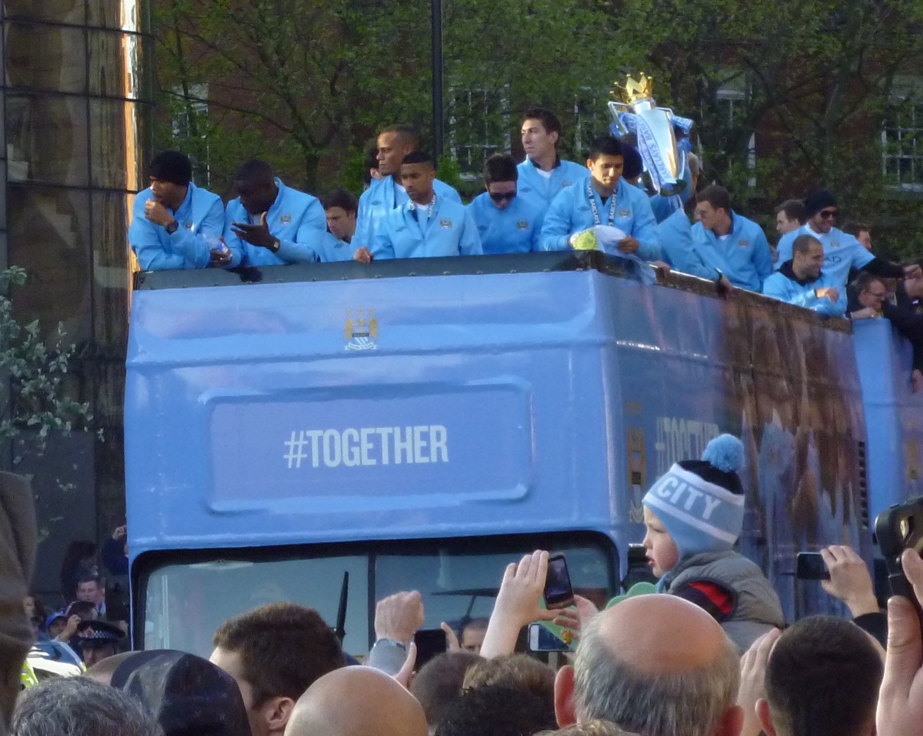 The Manchester City team on their victory parade following their Premier League title win
